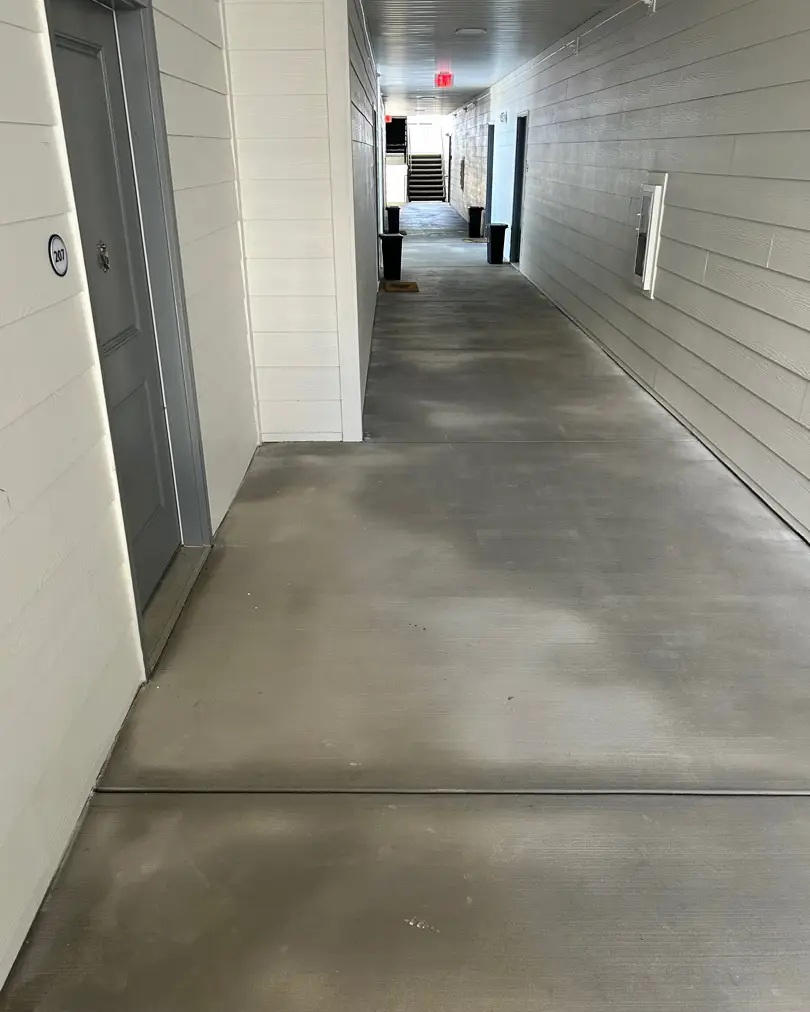 Clean apartment breezeway after pressure washing
