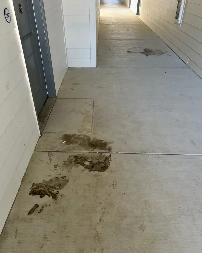 Apartment breezeway floor before cleaning service