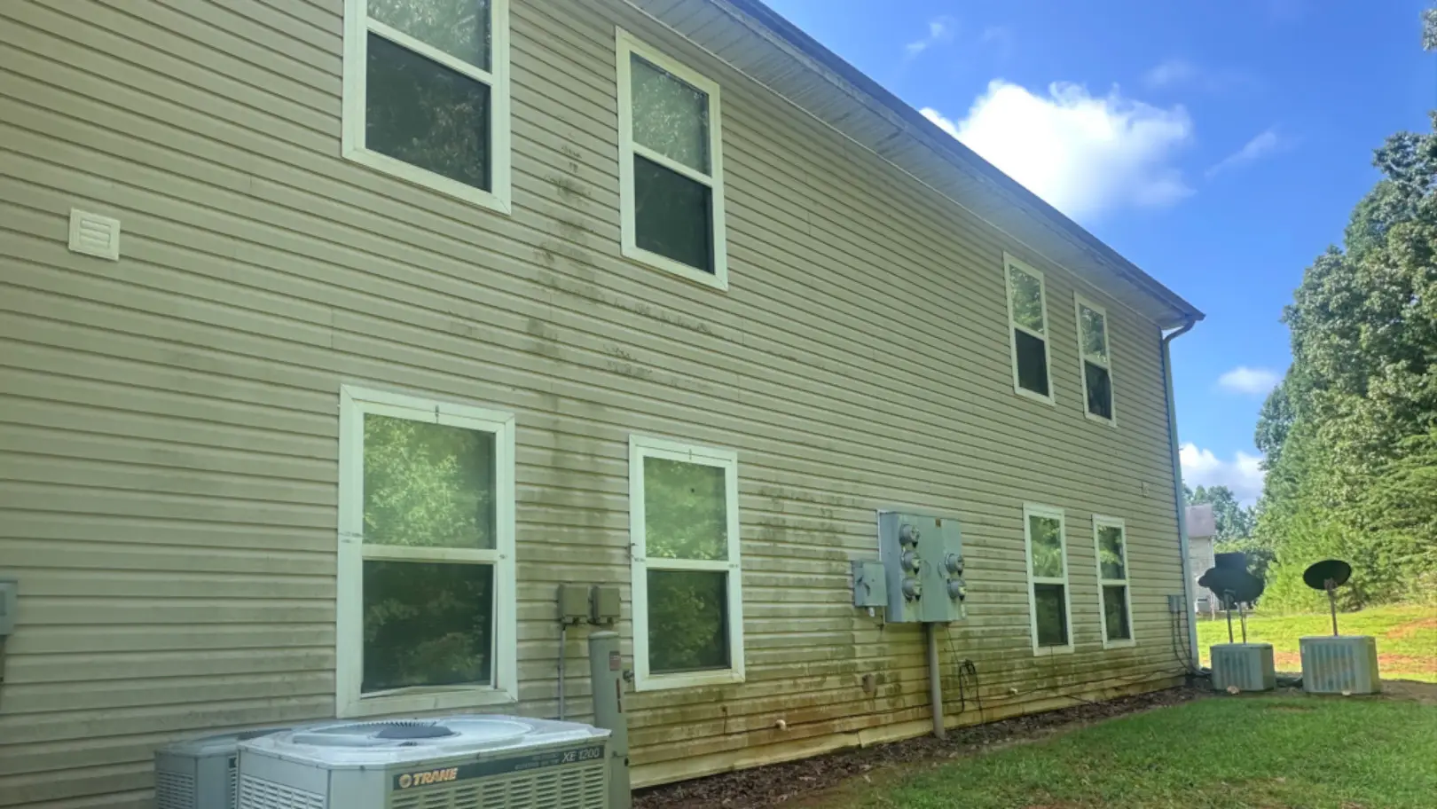 Commercial building siding before exterior cleaning