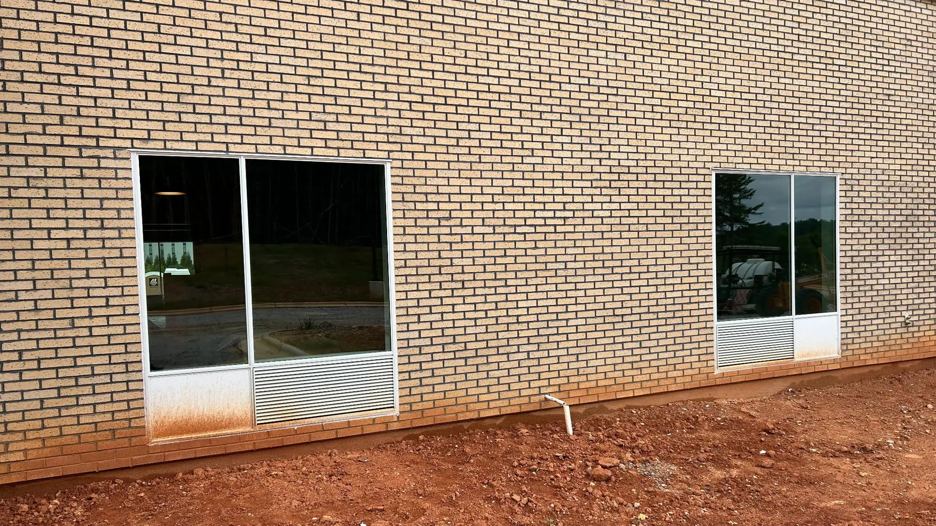 Commercial exterior windows and louvers before cleaning